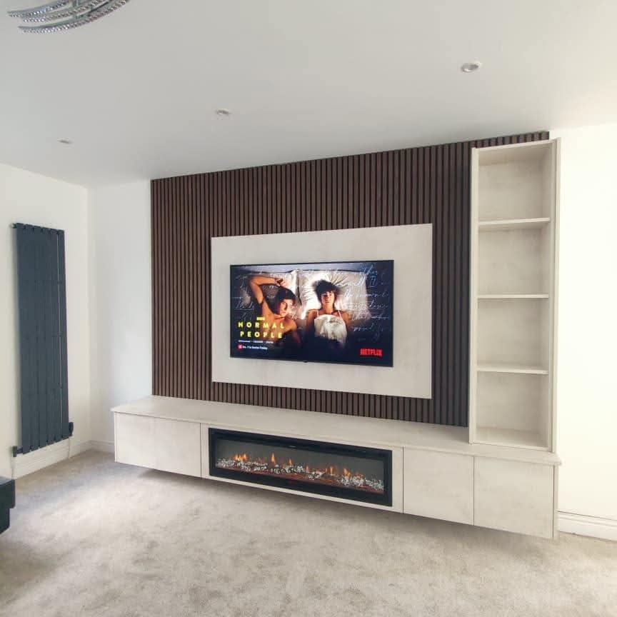 Dark wood slat media wall with floating TV unit Manchester